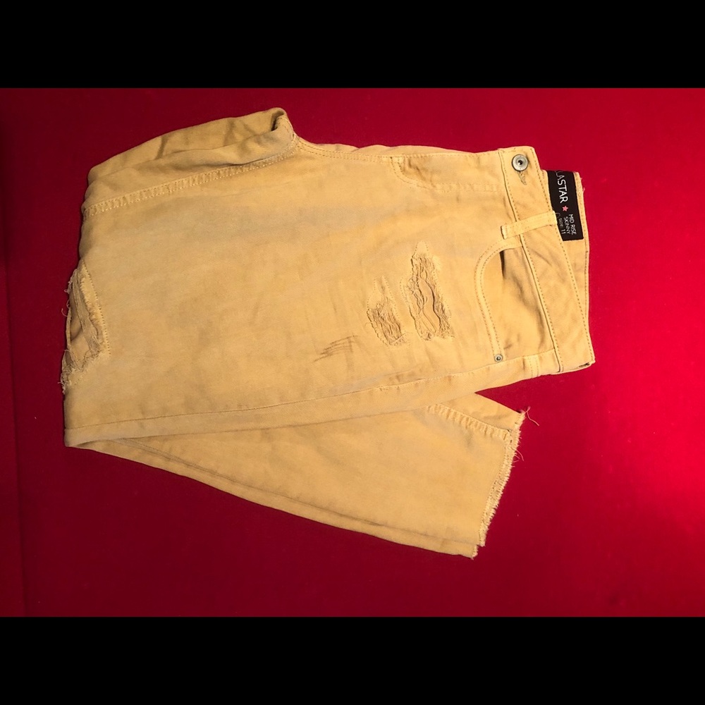 Gold distressed mid rise skinny Jean